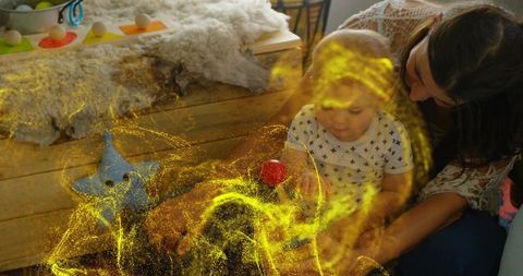 Mother and Toddler Engaged in Magical Playtime at Home