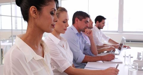 Serious Business Team Attentive in Meeting