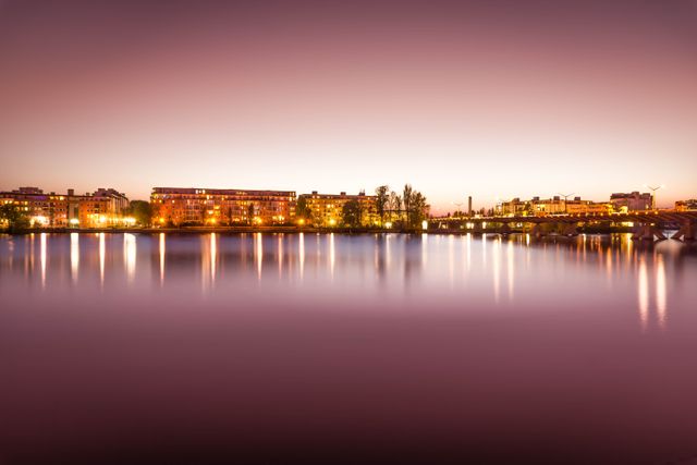 Brown Lighted Buildings Near the Body of Water Landscape Photo - Download Free Stock Photos Pikwizard.com