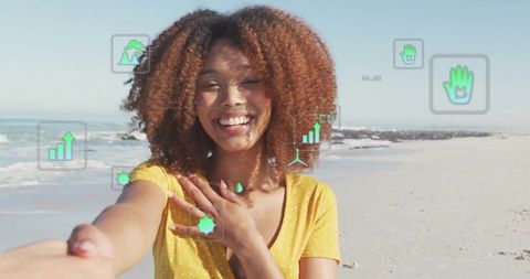 Smiling woman on beach with augmented reality overlays