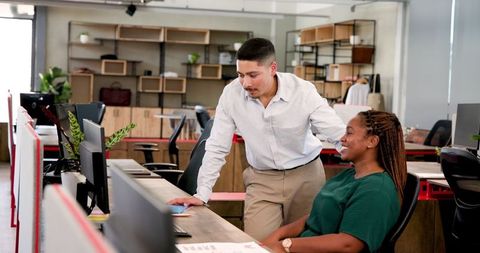 Colleagues Collaborating in Modern Office on Project