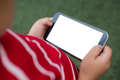 child in striped shirt holding transparent smartphone outdoors - Download Free Stock Videos Pikwizard.com