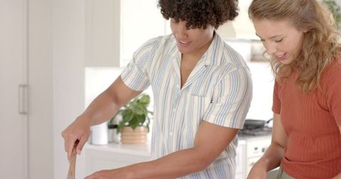 Enjoying Cooking Together in Modern Kitchen Interior