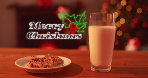 Festive cookies and milk with merry christmas text