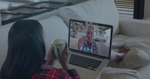 Woman Holding Coffee Enjoying Virtual Video Call from Couch - Download Free Stock Images Pikwizard.com