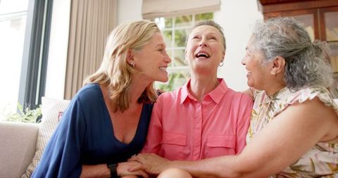 Senior Women Enjoying Time Together Indoors, Laughing