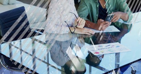 Business Meeting Analyzing Financial Data and Digitized Information