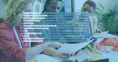 Diverse fashion designers collaborating on innovative designs in studio