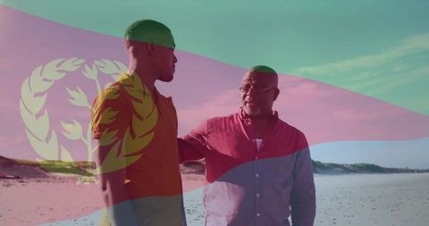 Eritrean flag overlay showing black father supporting adult son on coastal beach walk