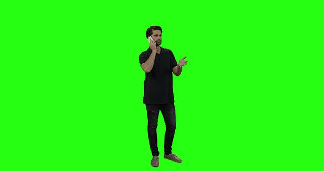 Man talking on mobile phone against green screen