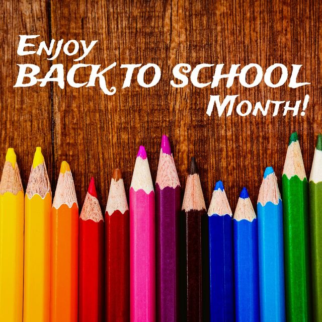 Digital composite of colored pencils with enjoy back to school month text on wooden table. art, school supplies, stationery, education and school concept.