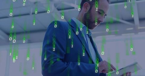 Businessman Tapping Tablet with Binary Data Overlay in Modern Corporate Office Lobby