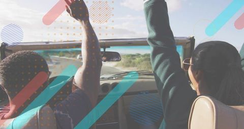 Couple driving convertible raising arms toward sky on coastal road sunglasses freedom adventure