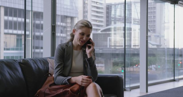 Businesswoman Talking on Phone in Modern Office Lobby - Download Free Stock Images Pikwizard.com