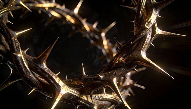 Glinting bronze crown of thorns with sharp spines and dramatic studio lighting