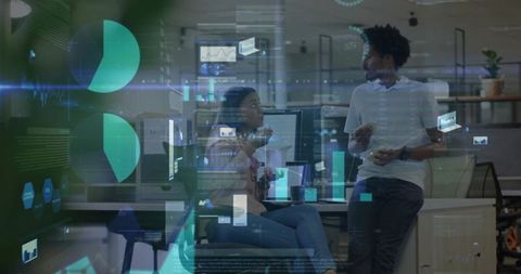 Office colleagues collaborating amidst data visualization