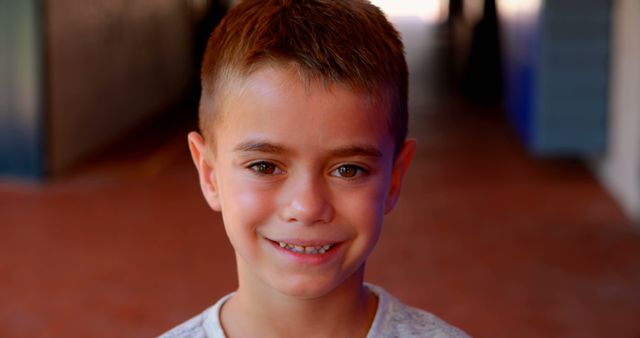 Smiling Boy with Short Brown Hair in Outdoor Passage - Download Free Stock Images Pikwizard.com