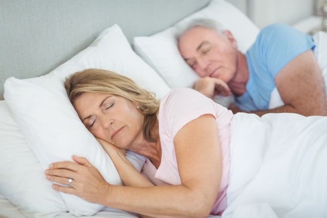 Senior Couple Sleeping Peacefully in Bed - Download Free Stock Photos Pikwizard.com