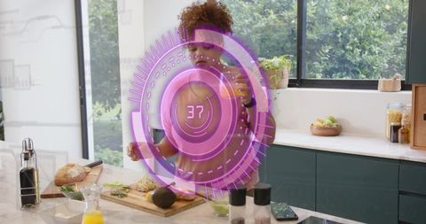 Home cook chopping avocado on kitchen island with purple ar hologram interface 37