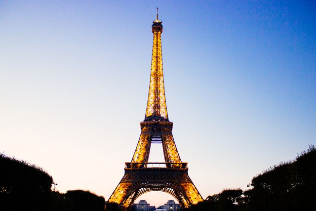 Illuminated Eiffel Tower at Twilight with Clear Sky - Download Free Stock Photos Pikwizard.com