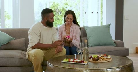 Couple Celebrating Anniversary with Gift at Home