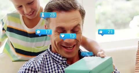Father and Son Sharing Surprise with Floating Social Media Icons