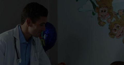 Pediatric Doctor Assisting Young Patient in Child-Friendly Clinic