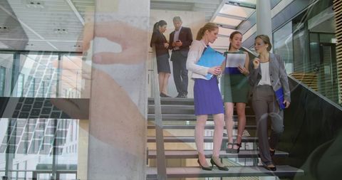 Business Team Discussing Technology on Office Stairs - Download Free Stock Images Pikwizard.com