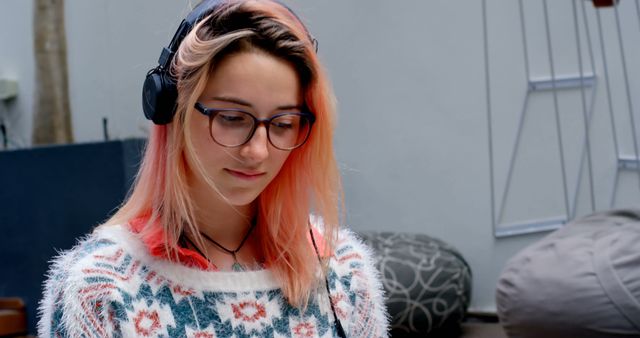 Focus Mode of Young Woman Listening to Music on Headphones at Home - Download Free Stock Images Pikwizard.com