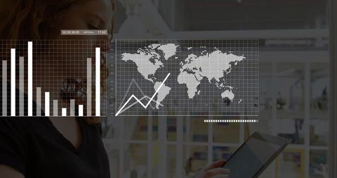 Analyzing global business data on tablet with world map and transparent analytics overlays