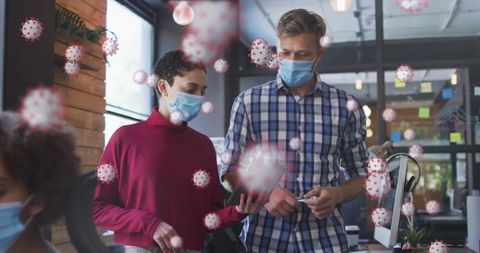 Office colleagues practicing safety measures during pandemic