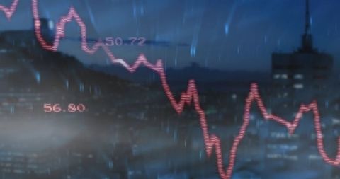 Dramatic Red Financial Graph Overlaying City at Night