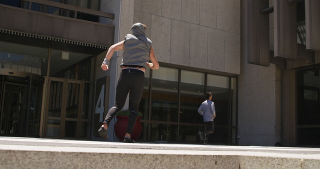 Two People Running on City Sidewalk in Urban Area - Download Free Stock Images Pikwizard.com