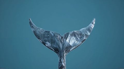 Abstract whale tail with metallic facets rising against blue background