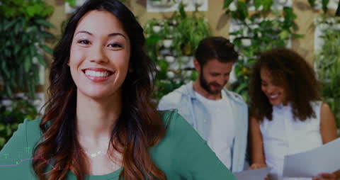 Diverse Professionals Analyzing Finance Data in Modern Office