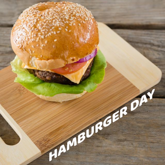 Delicious Burger on Wooden Board with Hamburger Day Text - Download Free Stock Templates Pikwizard.com