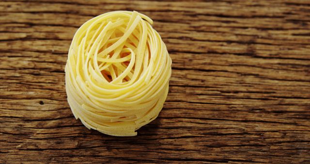 Raw Tagliatelle Pasta Nest on Rustic Wooden Background - Download Free Stock Images Pikwizard.com