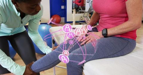 Physical therapist assessing knee mobility using augmented reality and smartwatch monitoring