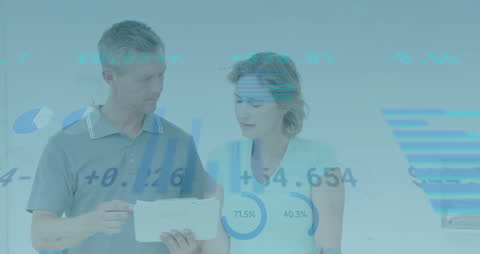 Business Team Analyzing Financial Data Over Digital Charts