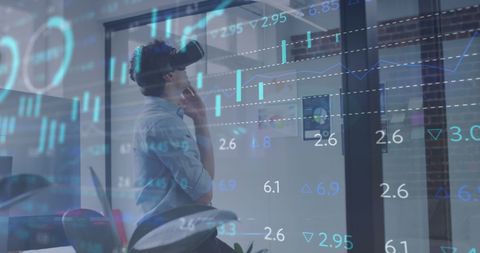 Businessman Analyzing Virtual Financial Data with VR Headset