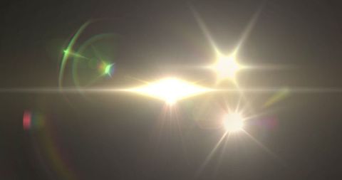 Abstract Light Flares on Dark Background Creating Lens Effects - Download Free Stock Images Pikwizard.com