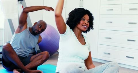 African American Couple Practicing Stretching Exercises at Home - Download Free Stock Images Pikwizard.com
