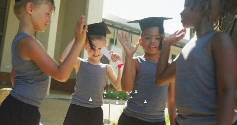 Children Celebrating Graduation with Enthusiastic High Fives