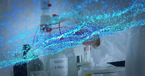 Scientist Conducting Research with Blue Particle Graphics Overlay