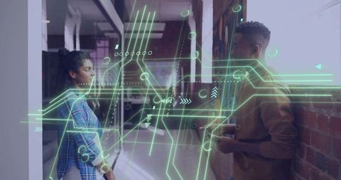 Collaborating over ar interface in modern office corridor with holographic circuitry overlay