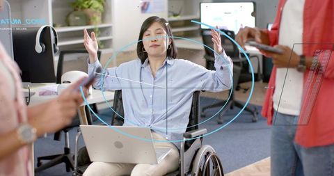 Leading inclusive tech collaboration from wheelchair with futuristic hud in modern office