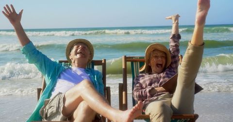 Joyful Senior Couple Relaxing on Beach