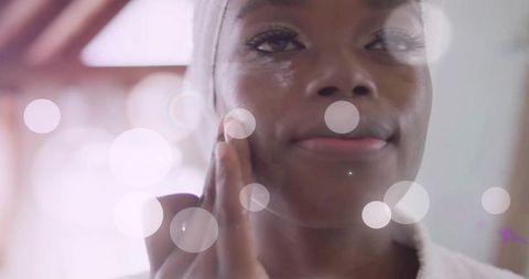 Woman Practicing Mindful Skincare in Soft Lighting