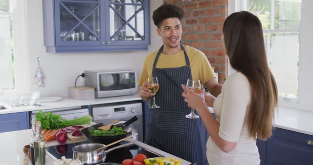 Couple Cooking Together in Modern Kitchen with Wine - Download Free Stock Images Pikwizard.com