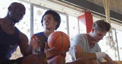 Diverse Basketball Teammates Relaxing After Intense Game
